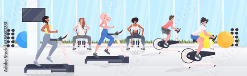 people doing physical exercises on training apparatus fitness workout healthy lifestyle concept modern gym interior full length horizontal vector illustration