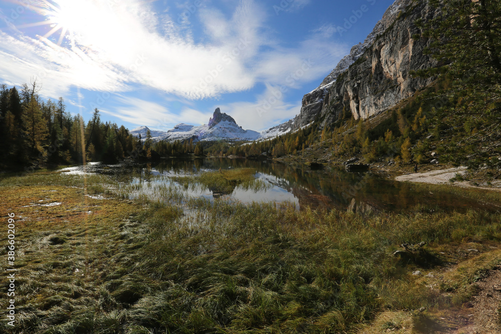 Fototapeta premium Autumn in the Dolomites, view of Federa lake surrounded by mountains
