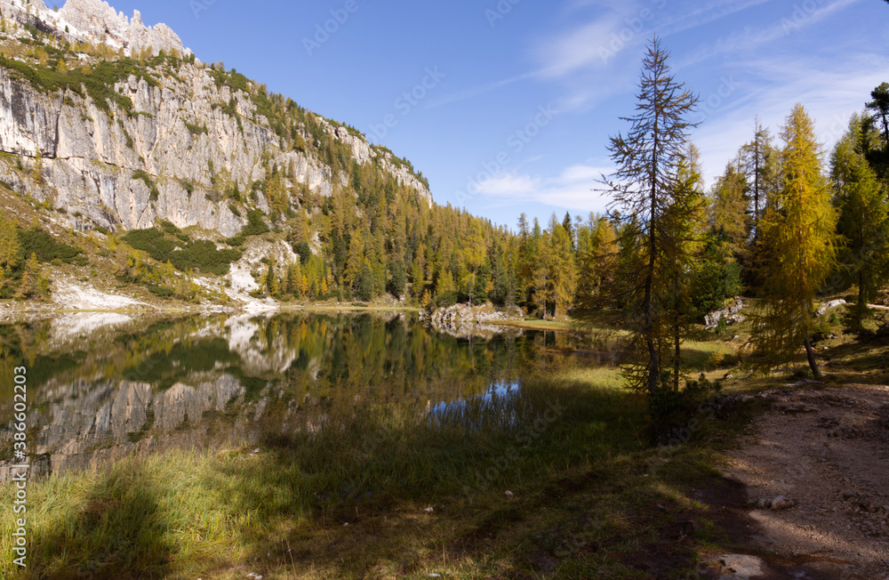 Autumn in the Dolomites, view of Federa lake surrounded by mountains