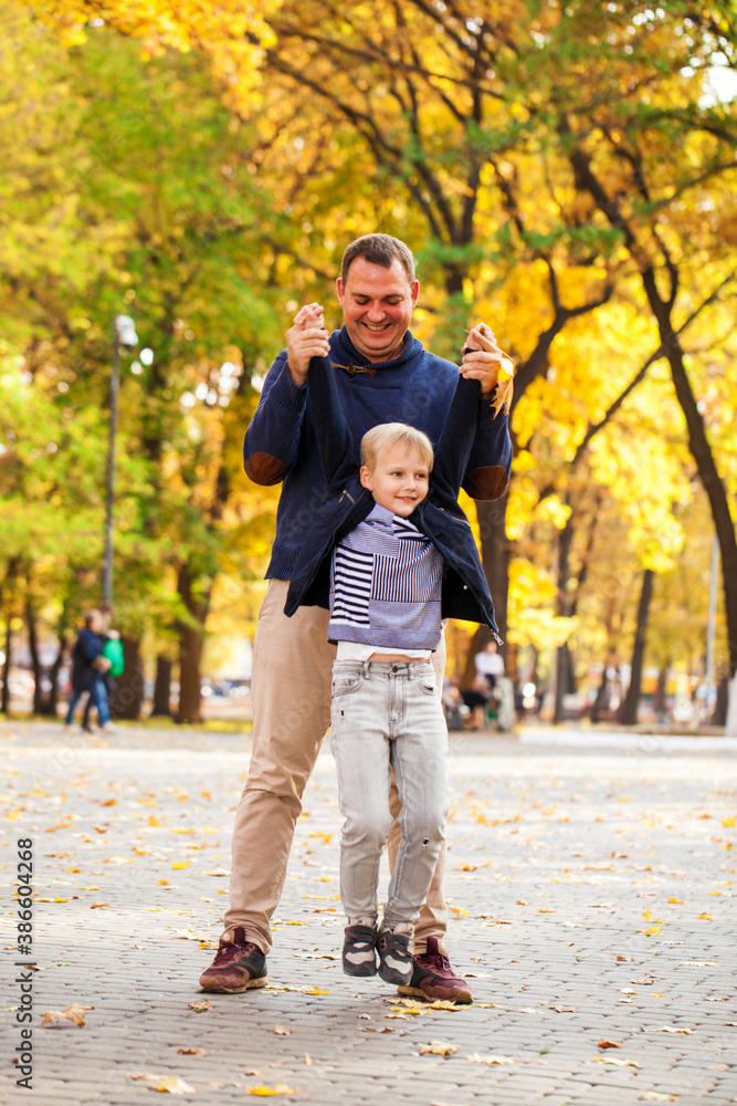 Fototapeta premium Blonde little boy in autumn park