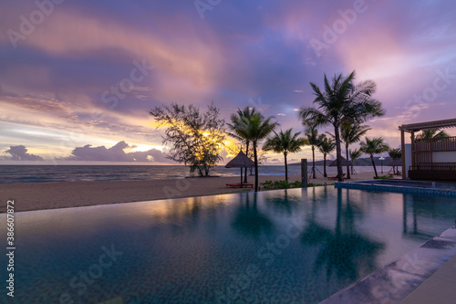 Beautiful sunset on the swimming pool with seaview © Prophoto