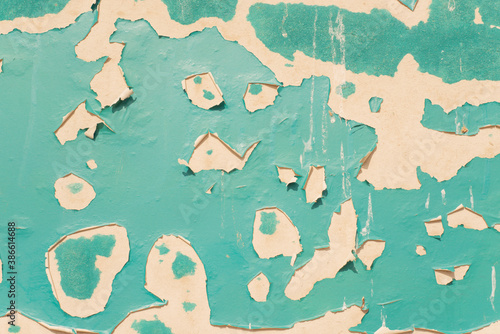 Turquoise and white concrete wall with peeling paint texture horizontal