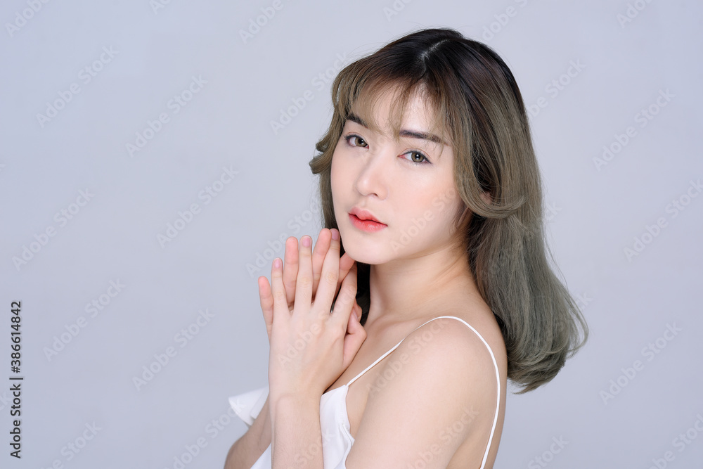 portrait of a beautiful Asian woman isolated on grey color background portrait of a beautiful Asian woman isolated on grey color background