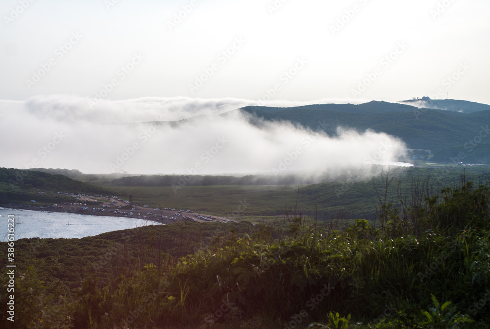 Fog over the Russian island bay