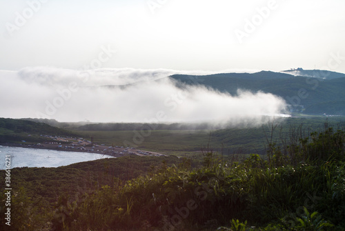 Fog over the Russian island bay