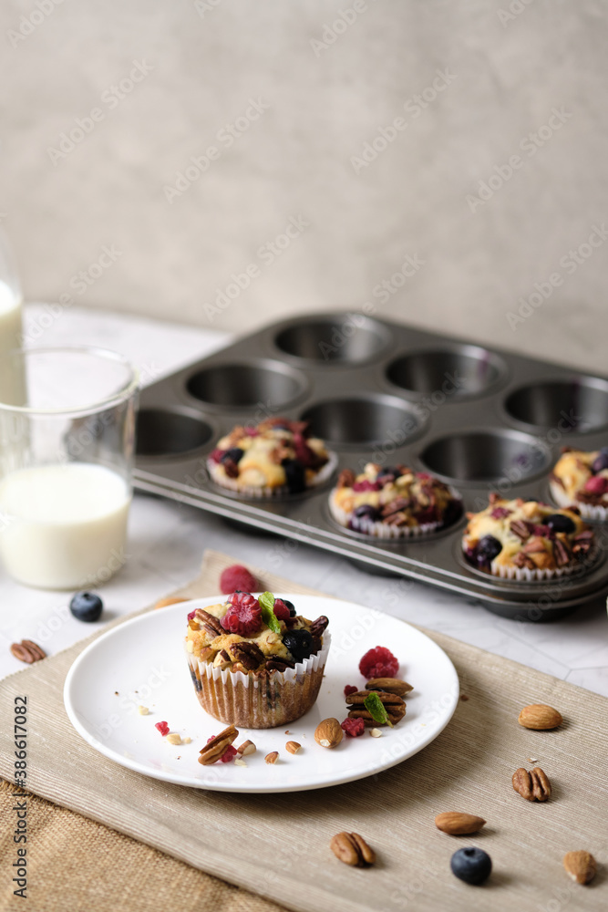 mixed berry low carb Keto Diet muffin with almond and nut. set on cafe table. mixed berry low carb Keto Diet muffin with almond and nut. set on cafe table.