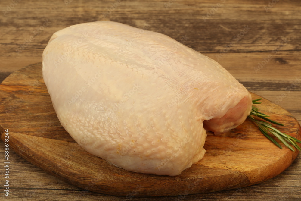 Raw whole chicken breast with skin Raw whole chicken breast with skin