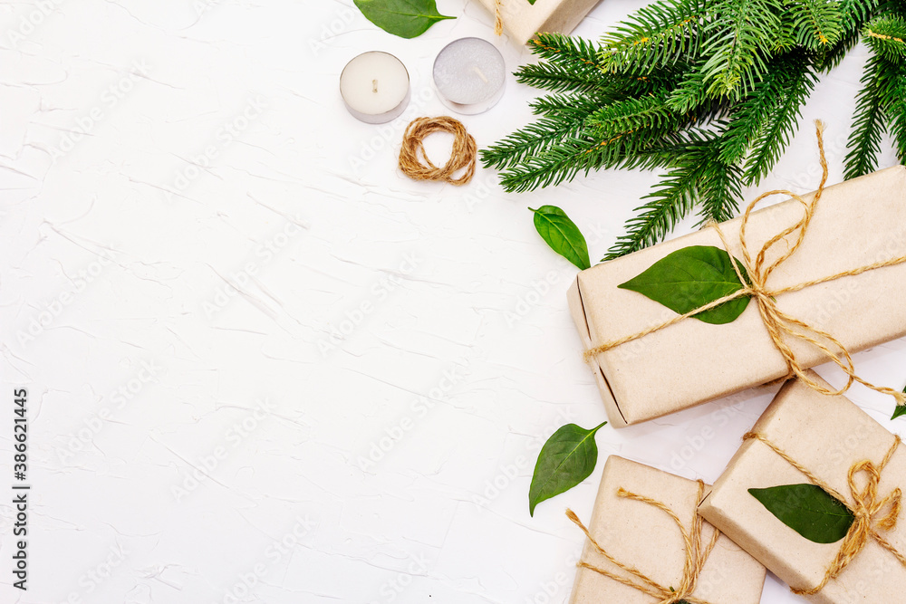 Zero waste gift concept with craft boxes and evergreen branches