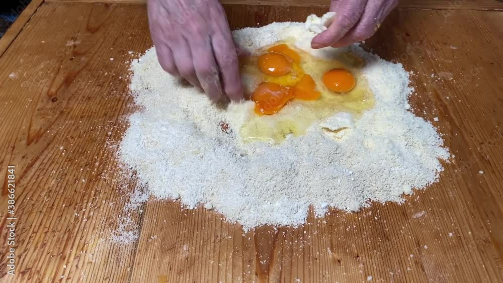mix flour and eggs to make traditional Italian desserts mix flour and eggs to make traditional Italian desserts