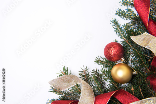 Festive Christmas background with red and gold bauble photo