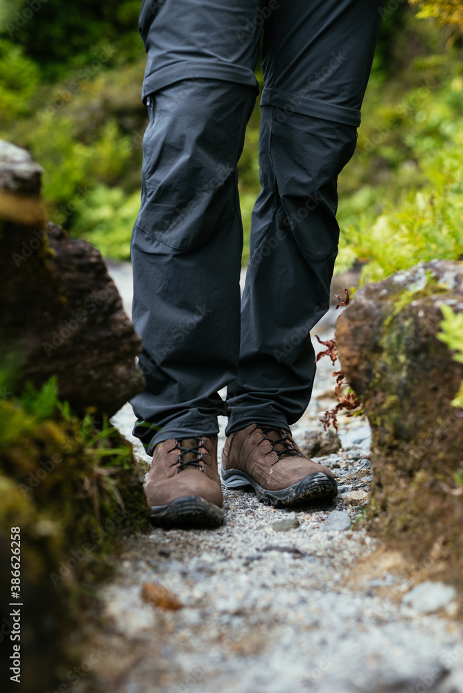 Close up. Hiking boots in the woods. Close up. Hiking boots in the woods.