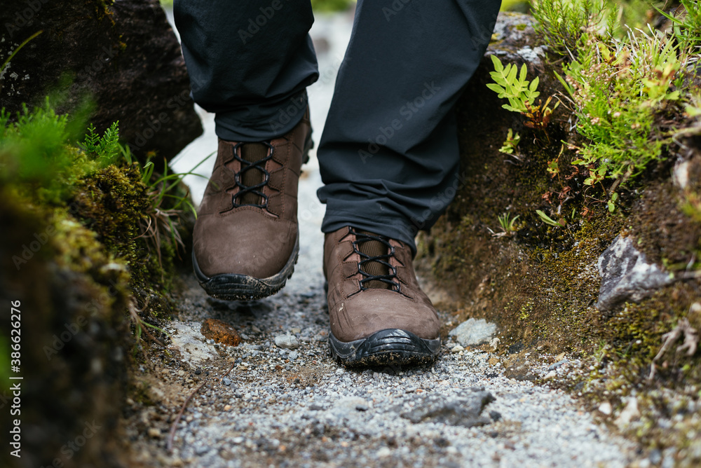 Close up. Hiking boots in the woods. Close up. Hiking boots in the woods.