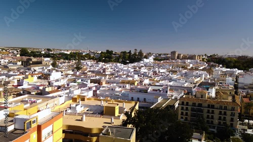 White buildings in cityscape of Sanlucar de Barrameda, Cadiz, Aerial Pan Right photo