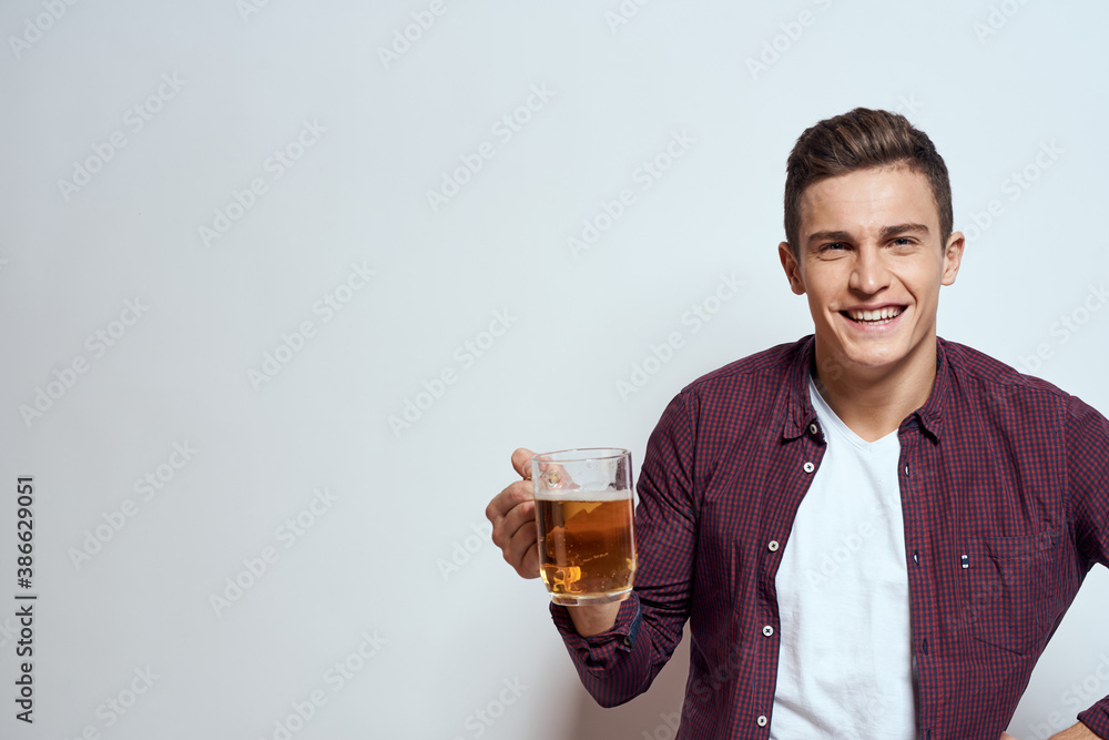 Man with a mug of beer fun alcohol lifestyle shirt light background