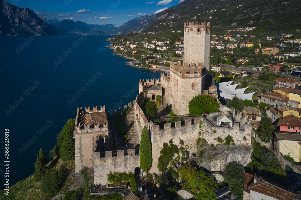Italian resort on Lake Garda, Monte Baldo. Malcesine town, Lake Garda, Italy. Panoramic aerial view of Scaliger Castle in Malcesine, Malcesine town.