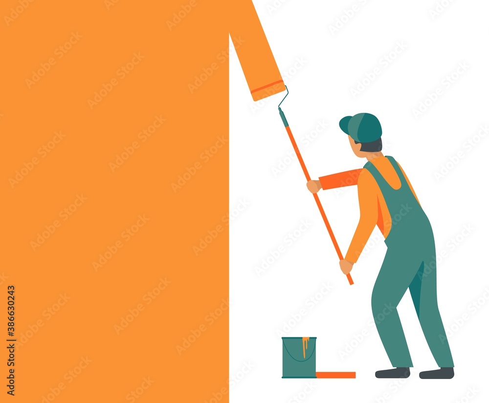 Man in overalls, working uniform with a roller paints, repaints the wall in orange color.