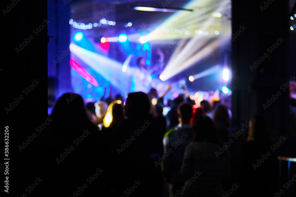 Music Concert background blur. Blurred People dancing with original bokeh lights in background - Defocused image for an artistic touch of disco club - Concept of nightlife with music and entertainment Music Concert background blur. Blurred People dancing with original bokeh lights in background - Defocused image for an artistic touch of disco club - Concept of nightlife with music and entertainment