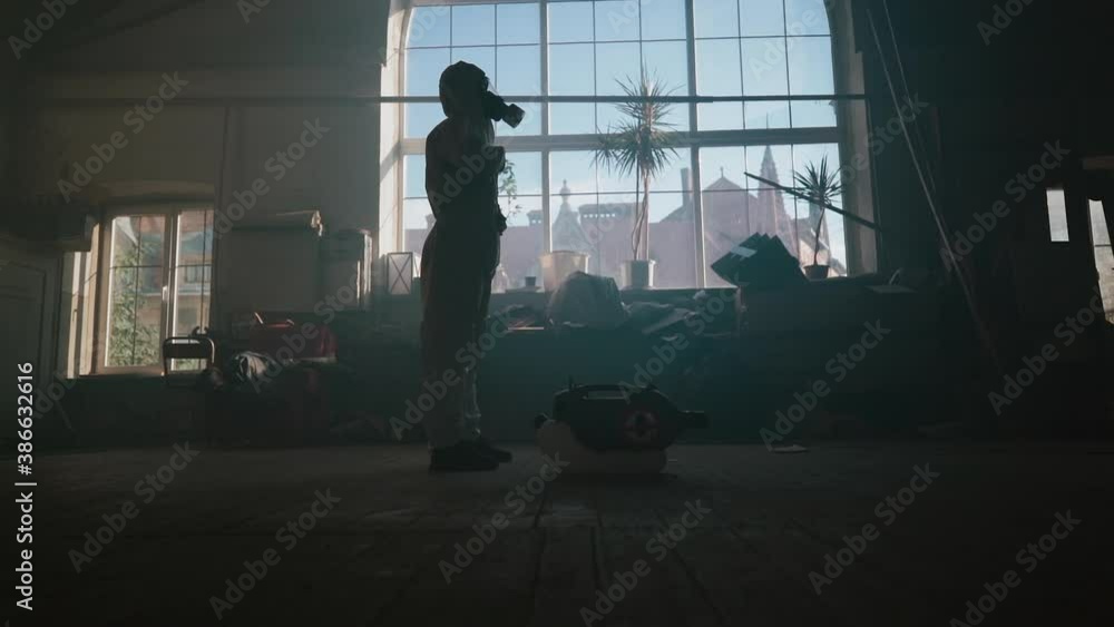 Lonely human in protective gas mask. Protective suit clothes. Lonely human in protective gas mask. Protective suit clothes.