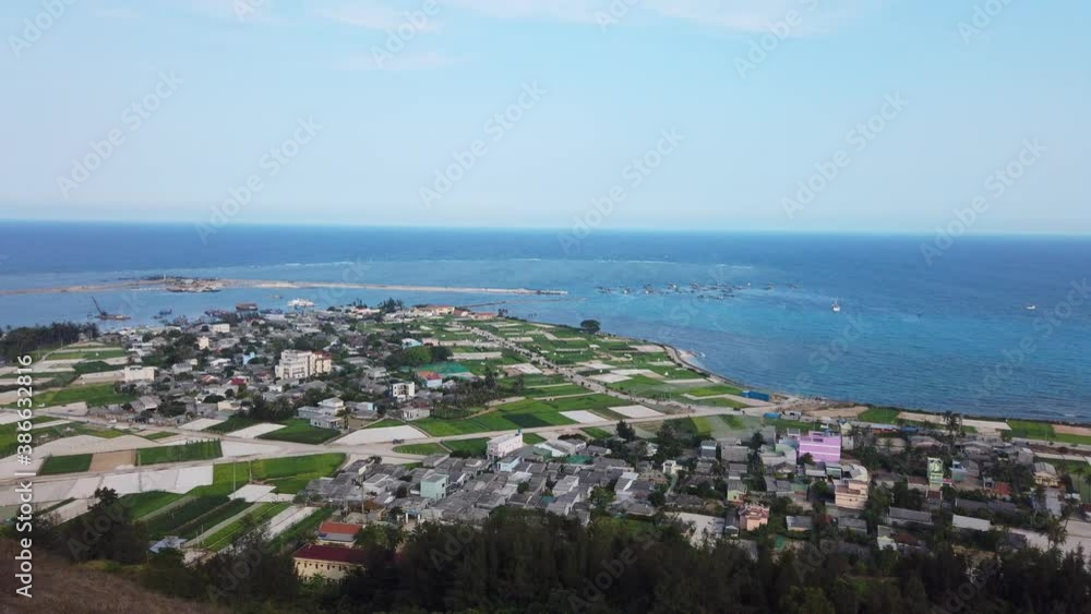 high view from Thoi Loi Mountain, fishing village and garlic fields at Ly Son island, Quang Ngai Province, Viet Nam high view from Thoi Loi Mountain, fishing village and garlic fields at Ly Son island, Quang Ngai Province, Viet Nam