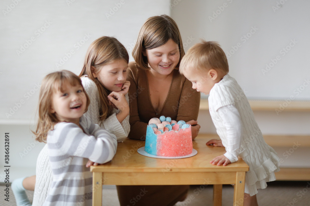 Kids at gender reveal party, cake pink and blue, boy or girl party, Kids at gender reveal party, cake pink and blue, boy or girl party,