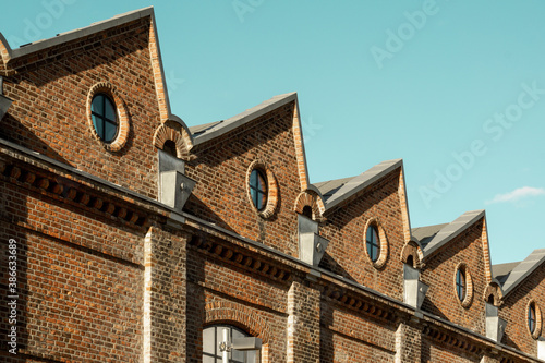 Photography Zigzag roof structure, round windows and repetition in Architecture