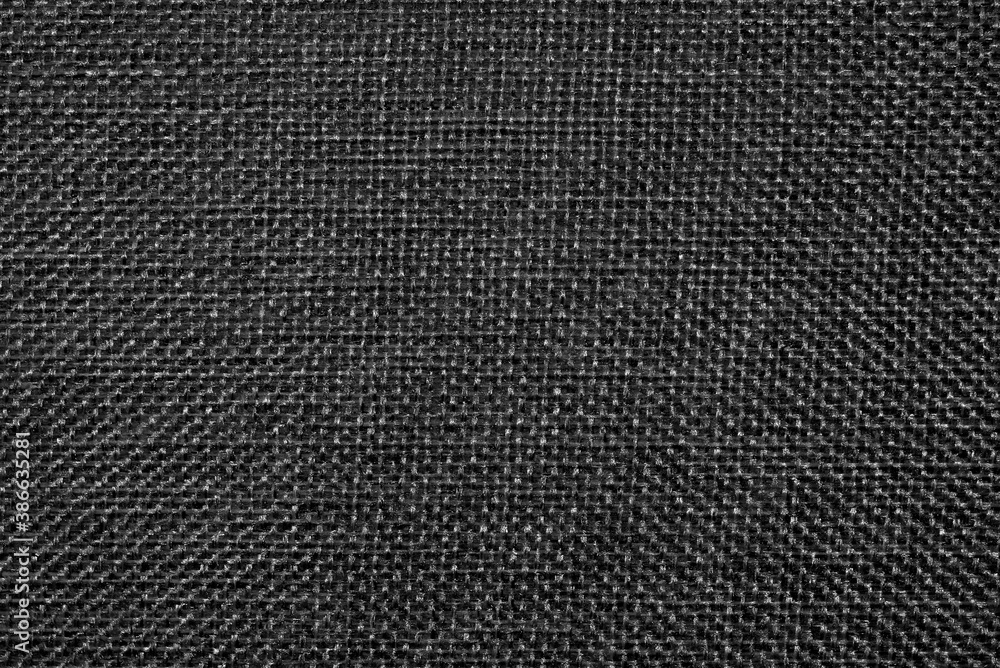 Abstract cloth background in black and white. A seamless texture in a low key. Abstract cloth background in black and white. A seamless texture in a low key.