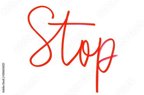 Handwritten inscription Stop in red marker on white background