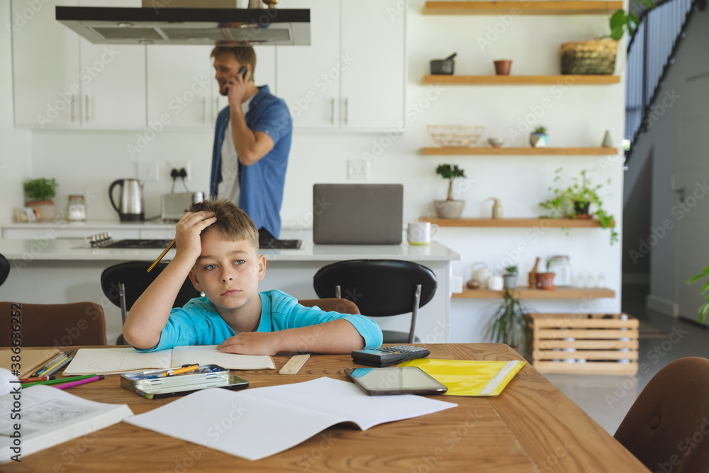 Boy doing homework at home Boy doing homework at home