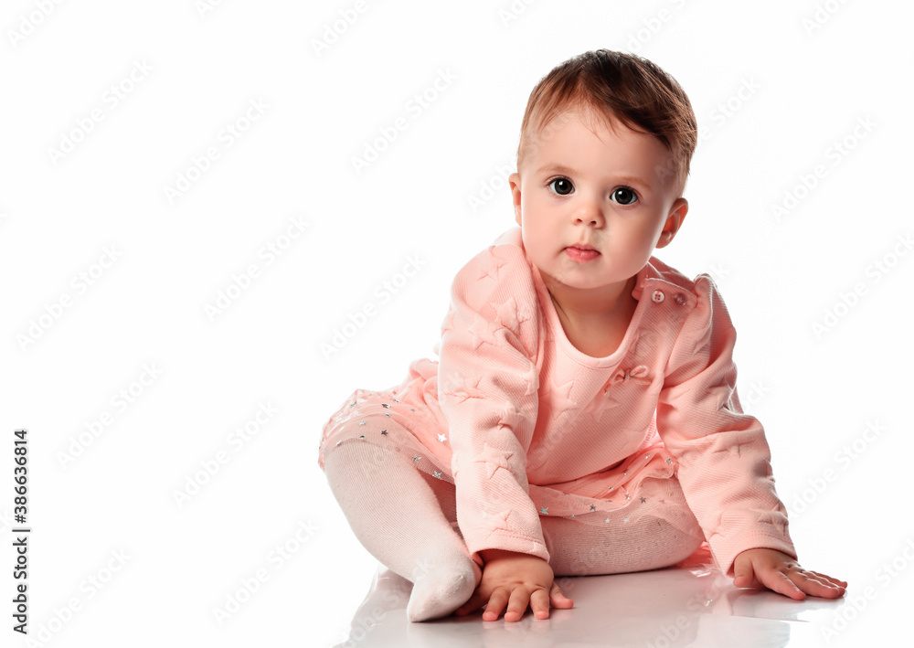 Cute baby girl sitting isolated on white background Cute baby girl sitting isolated on white background