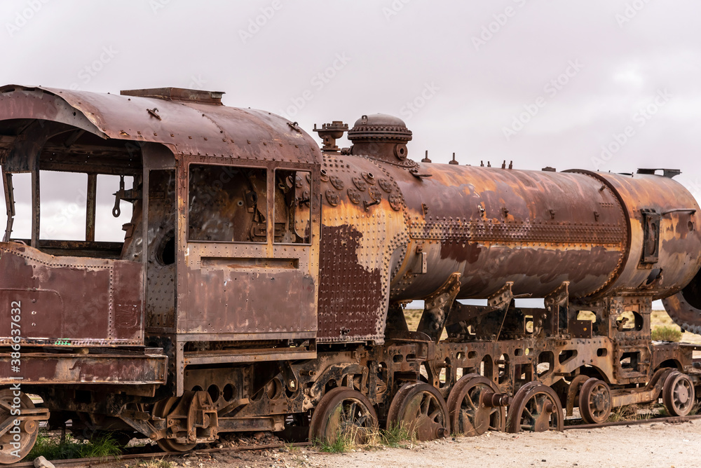 Old rusty locomotive abandoned in a train cemetery. Uyuni, Bolivia Old rusty locomotive abandoned in a train cemetery. Uyuni, Bolivia
