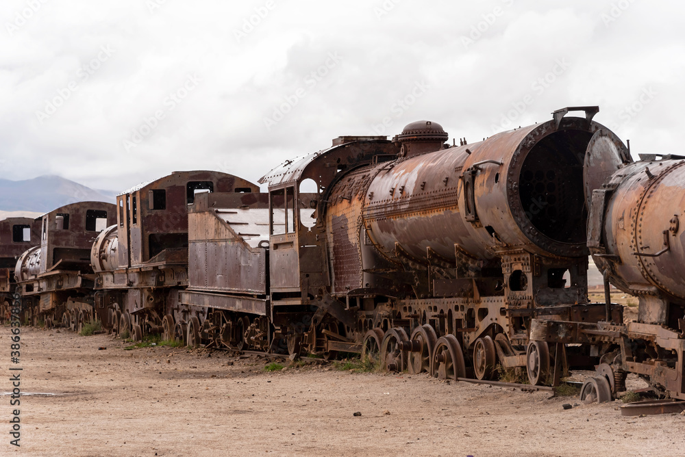 Old rusty locomotive abandoned in a train cemetery. Uyuni, Bolivia Old rusty locomotive abandoned in a train cemetery. Uyuni, Bolivia