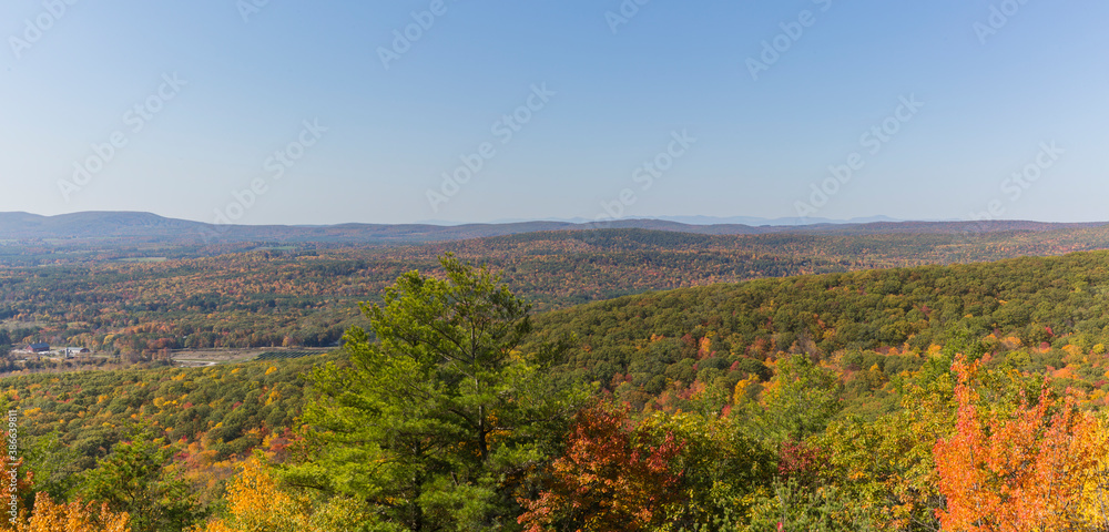Colorful Autumn vistas of mountains and valleys. Yellow, orange and red leaves glisten in the sunshine- 7