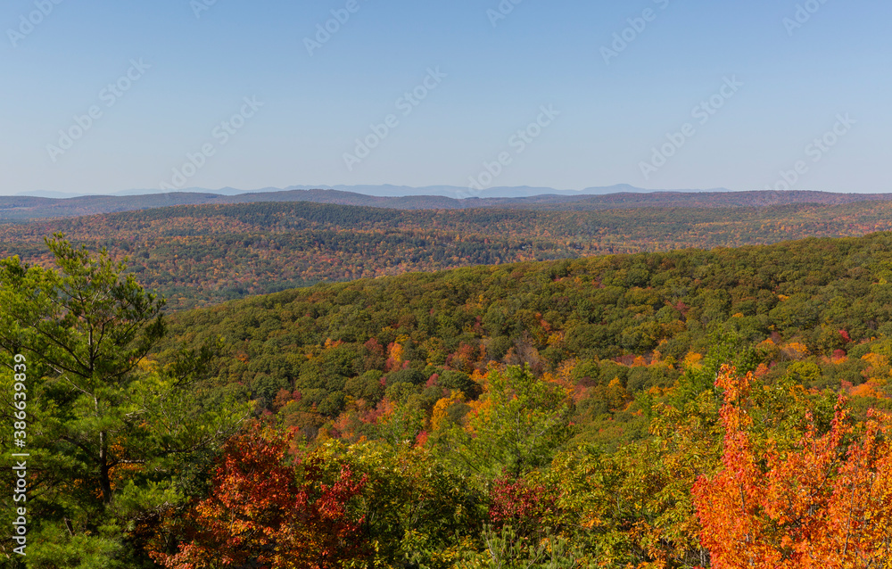 Colorful Autumn vistas of mountains and valleys. Yellow, orange and red leaves glisten in the sunshine- 6