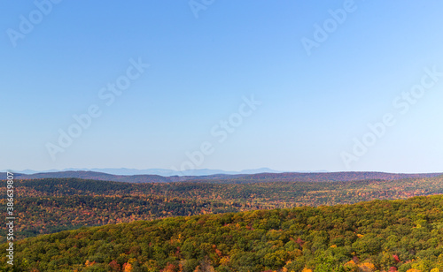 Colorful Autumn vistas of mountains and valleys. Yellow, orange and red leaves glisten in the sunshine- 8