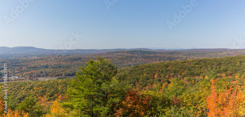 Colorful Autumn vistas of mountains and valleys. Yellow  orange and red leaves glisten in the sunshine- 7