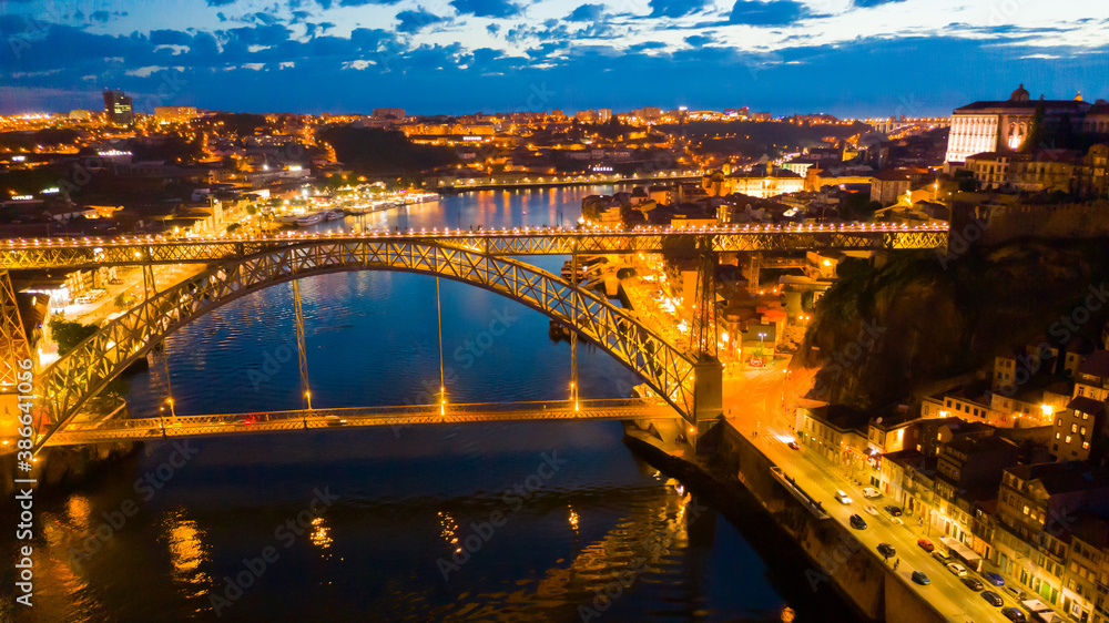 Aerial view illuminated of the Ponte de Dom Luis Bridge at night, Porto, Portugal