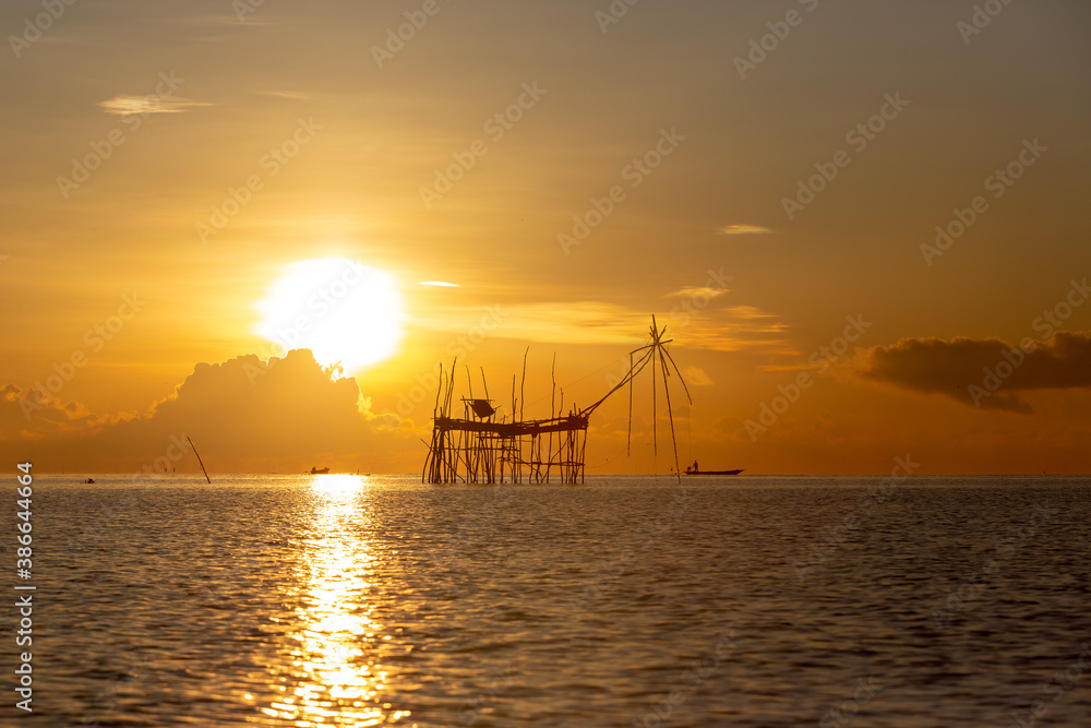 Chinese fish nets during sunrise in Phatthalung province, Thailand