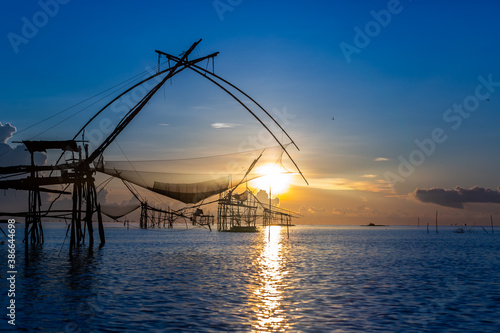 Chinese fish nets during sunrise in Phatthalung province, Thailand