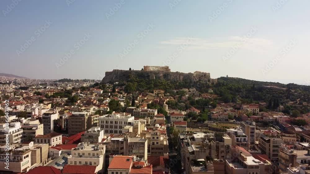 Aerial backwards shot of historic Parthenon Temple on Acropolis Hill in Athens,Greece. Aerial backwards shot of historic Parthenon Temple on Acropolis Hill in Athens,Greece.