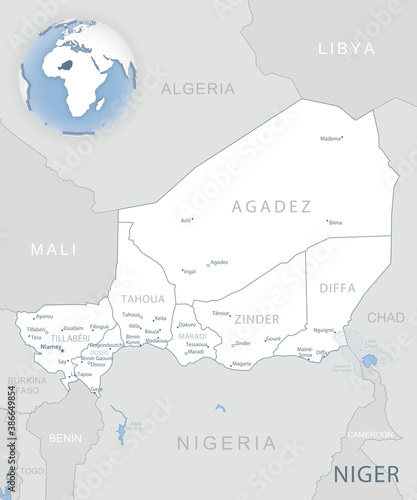 Blue-gray detailed map of Niger administrative divisions and location on the globe.