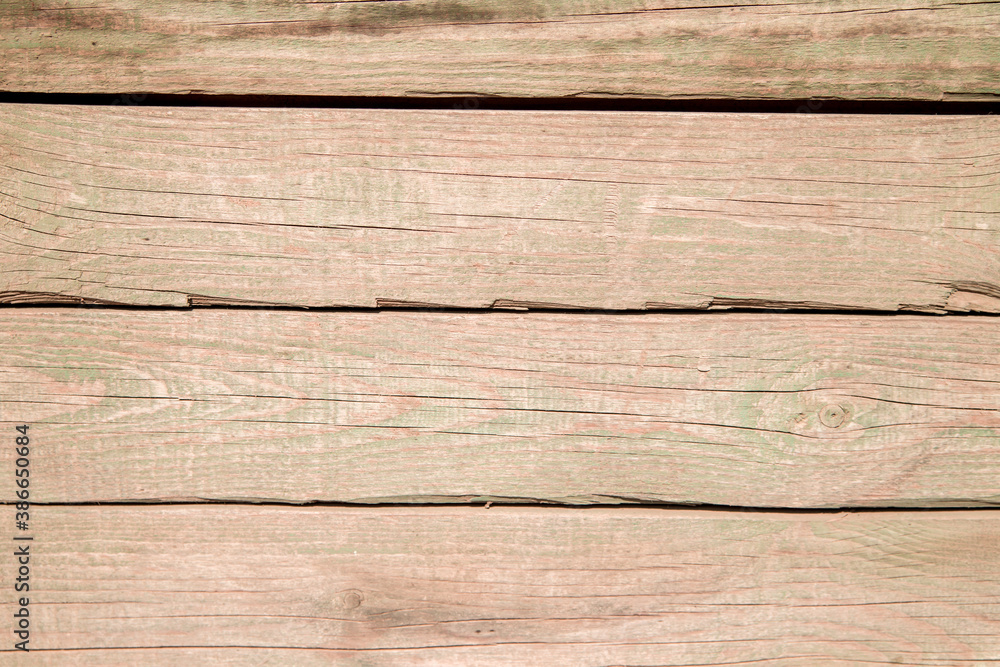 Fototapeta premium Old wooden planks.Boards with cracked relief and paint residue.