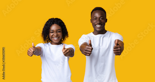 Photography Emotional black man and woman showing thumbs up