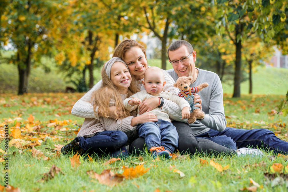 Fototapeta premium happy family on autumn picnic in park
