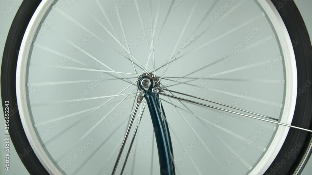 Testing the rotation of the Bicycle wheel after repair. the concept of repair, traveling by Bicycle Testing the rotation of the Bicycle wheel after repair. the concept of repair, traveling by Bicycle