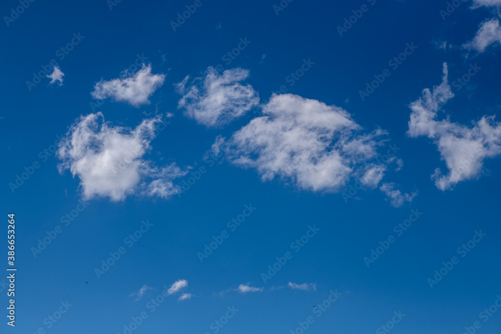 White clouds in the blue sky. A beautiful view of natural nature. White clouds in the blue sky. A beautiful view of natural nature.