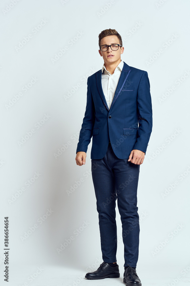 Fototapeta premium business man in suit wearing glasses self-confidence manager executive light background