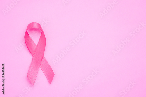 breast cancer awareness ribbon on pink background