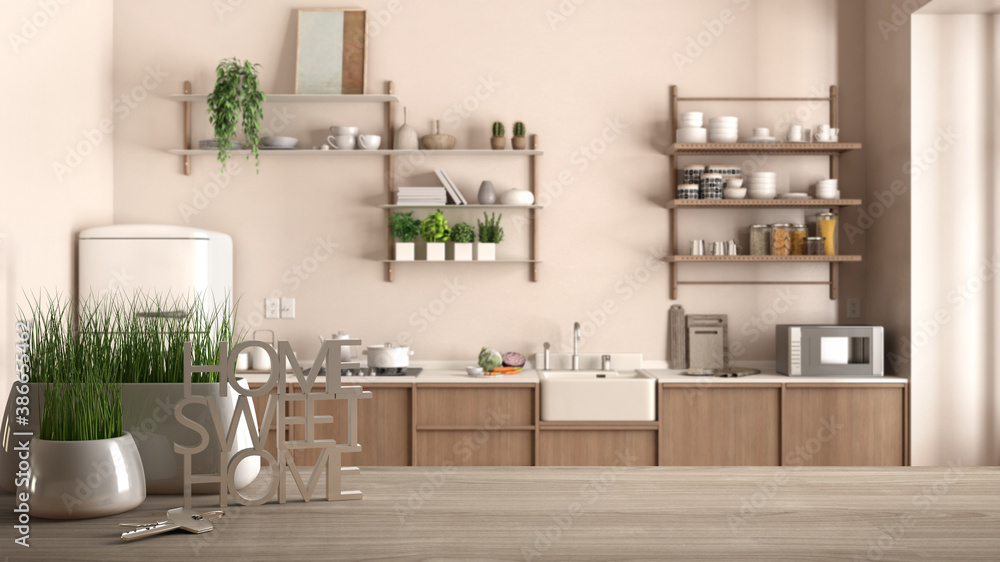 Fototapeta premium Wooden table, desk or shelf with potted grass plant, house keys and 3D letters home sweet home, over kitchen with shelves, decors, architecture interior design, copy space background