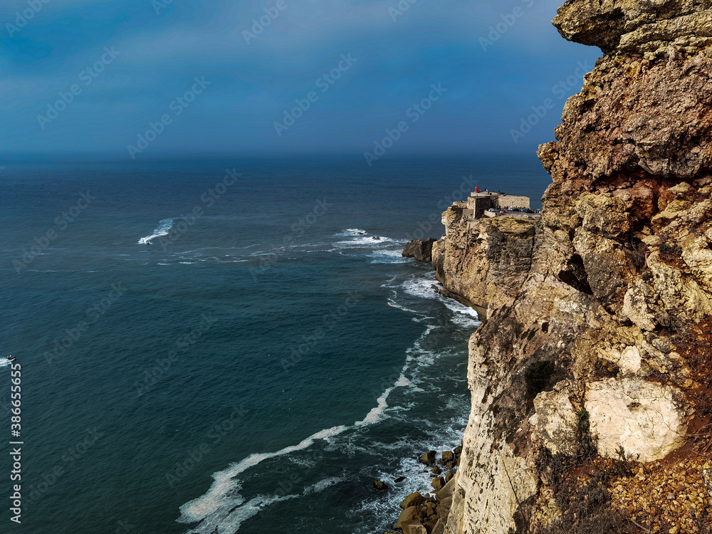 Lighthouse over the sea of Nazare 