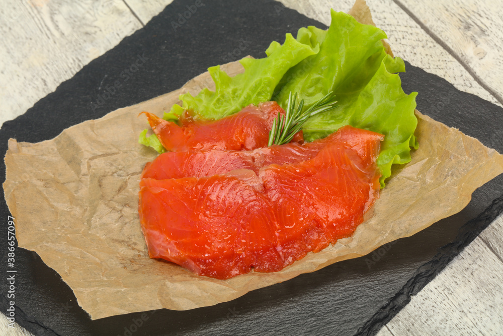 Sliced salmon fillet served rosemary Sliced salmon fillet served rosemary
